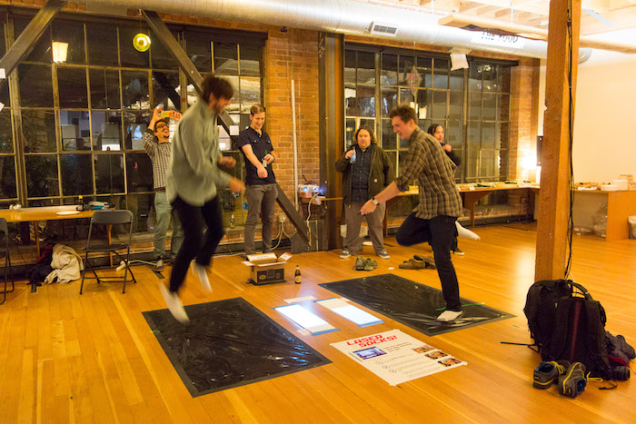 Two people playing a game of Laser Socks