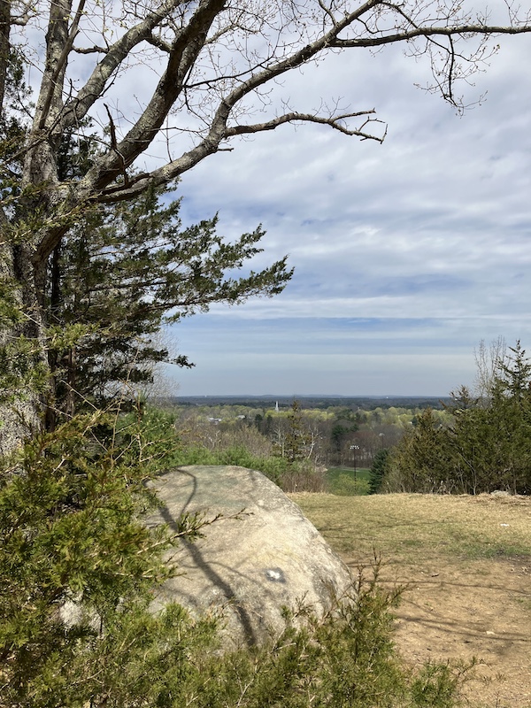 A boulder on top of a hill.